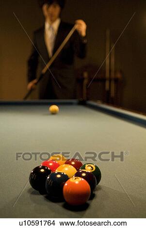 Businessman playing pool View Large Photo Image Picture - Businessman playing pool. Fotosearch