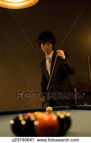 Businessman playing pool View Large Photo Image Stock Photo - Businessman playing pool. Fotosearch