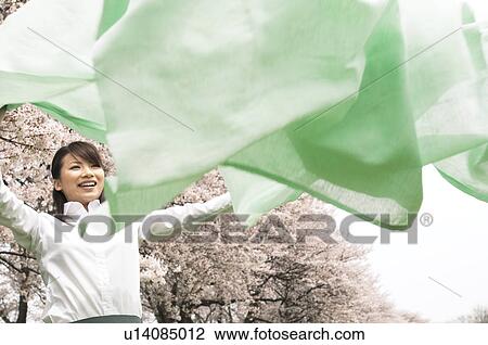 Businesswoman laying down a picnic blanket View Large Photo Image Stock Image - Businesswoman laying down a picnic blanket. Fotosearch