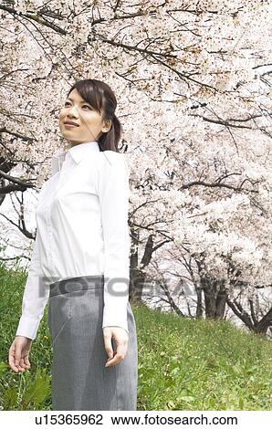 Stock Image - Businesswoman looking into the distance. Fotosearch