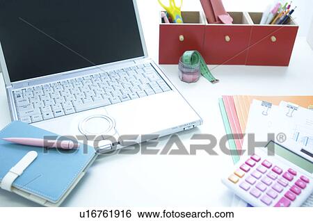 Calculator, laptop and files on desk View Large Photo Image Stock Photograph - Calculator, laptop and files on desk. Fotosearch