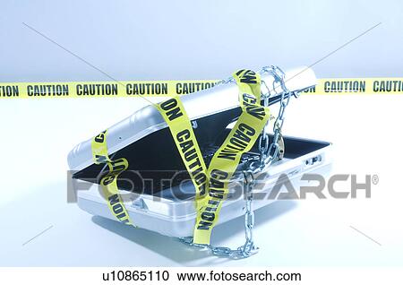 Case with laptop covered in chains and cordon tape View Large Photo Image Stock Image - Case with laptop covered in chains and cordon tape. Fotosearch