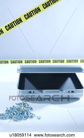 Picture - Case with laptop with chains and cordon tape. Fotosearch