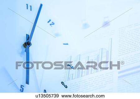 Clock and documents with graph View Large Photo Image Stock Photo - Clock and documents with graph. Fotosearch