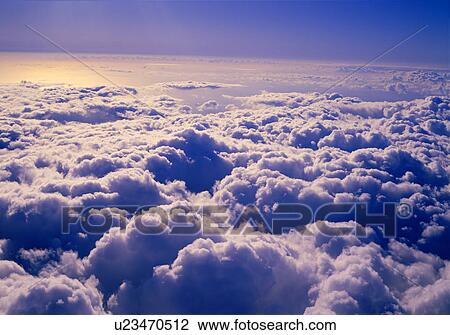 Stock Image - Clouds in blue sky. Fotosearch