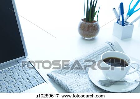 Coffee and newspaper on desk View Large Photo Image Stock Photo - Coffee and newspaper on desk. Fotosearch