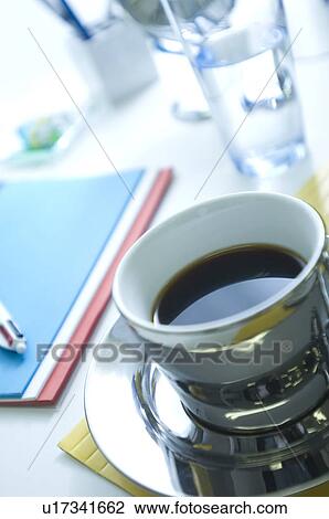 Coffee on desk in office View Large Photo Image Stock Image - Coffee on desk in office. Fotosearch