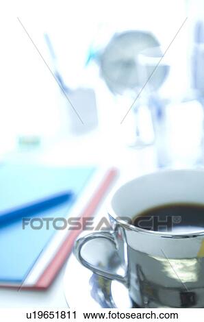 Coffee on desk in office View Large Photo Image Stock Image - Coffee on desk in office. Fotosearch