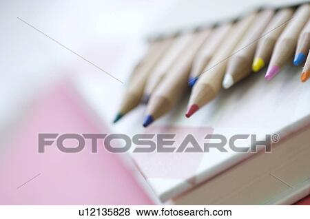 Coloring pencils on book View Large Photo Image Stock Photo - Coloring pencils on book. Fotosearch