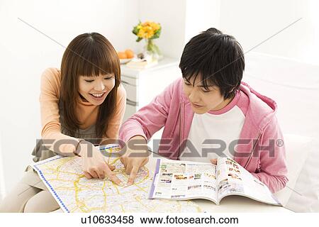 Couple in hospital making travel plans for the future View Large Photo Image Stock Photo - Couple in hospital making travel plans for the future. Fotosearch