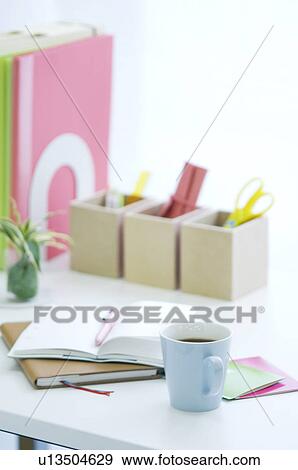Stock Photo - Desk with open notebook and coffee. Fotosearch