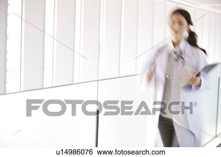 Doctor running with chart through hallway View Large Photo Image Stock Photograph - Doctor running with chart through hallway. Fotosearch
