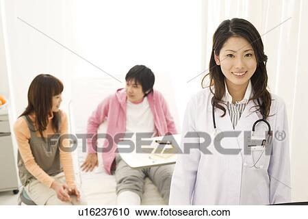 Doctor with a patients in a hospital room View Large Photo Image Stock Image - Doctor with a patients in a hospital room. Fotosearch