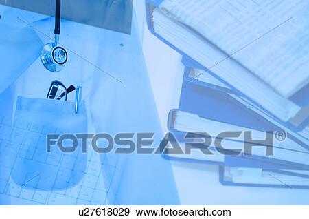 Stock Photo - Doctor's lab coat and accessories with books. Fotosearch