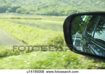 Stock Photo - Farm scenery from car perspective. Fotosearch