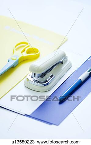 Stock Image - Files, stapler, scissors and pen. Fotosearch