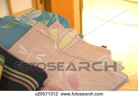 Folded yukata next to a lantern View Large Photo Image Stock Image - Folded yukata next to a lantern. Fotosearch