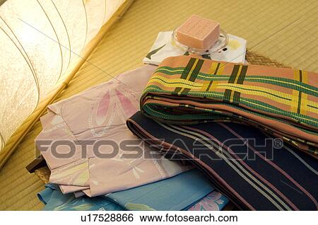 Folded yukata next to a lantern View Large Photo Image Stock Photograph - Folded yukata next to a lantern. Fotosearch