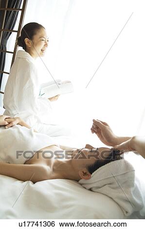 Friends take turns receiving massages View Large Photo Image Stock Photograph - Friends take turns receiving massages. Fotosearch