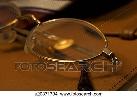 Picture - Glasses on desk. Fotosearch