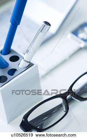 Glasses, pens, calculator and wristwatch on desk View Large Photo Image Stock Photo - Glasses, pens, calculator and wristwatch on desk. Fotosearch