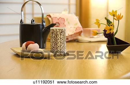 Japanese teapot and teacups a with rice cake View Large Photo Image Stock Image - Japanese teapot and teacups a with rice cake. Fotosearch