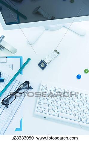 Keyboard and glasses on desk with documents, ruler and watch View Large Photo Image Stock Image - Keyboard and glasses on desk with documents, ruler and watch. Fotosearch