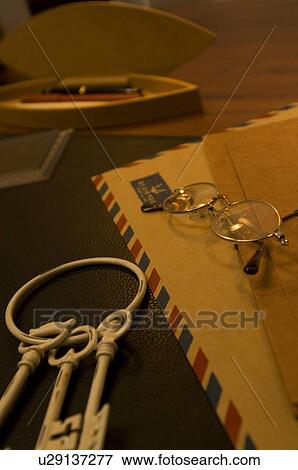 Stock Photo - Keys and air mail on desk. Fotosearch