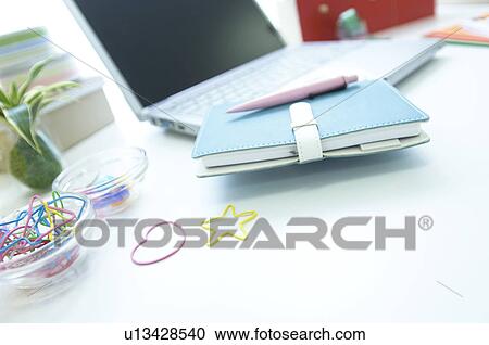 Laptop and notebook on desk View Large Photo Image Stock Image - Laptop and notebook on desk. Fotosearch