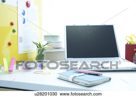 Laptop and notebook on desk View Large Photo Image Stock Image - Laptop and notebook on desk. Fotosearch