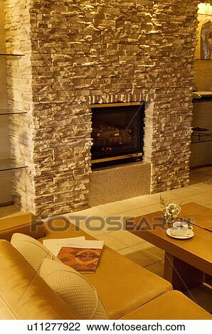 Stock Image - Living room with fireplace. Fotosearch