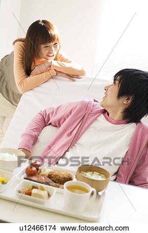 Man having a meal in his hospital bed View Large Photo Image Picture - Man having a meal in his hospital bed. Fotosearch