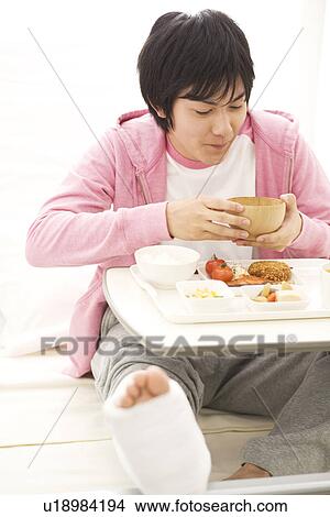 Man having a meal in his hospital bed View Large Photo Image Picture - Man having a meal in his hospital bed. Fotosearch