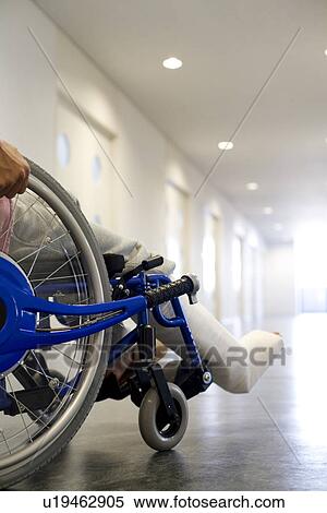 Man with broken leg in a wheelchair View Large Photo Image Stock Photography - Man with broken leg in a wheelchair. Fotosearch