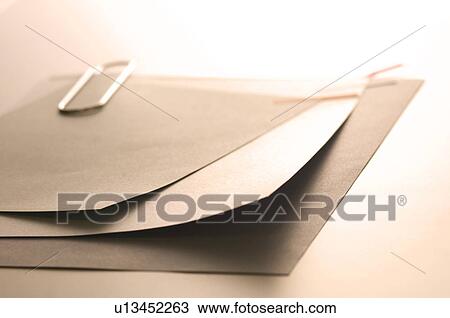 Memo held together with a paper clip View Large Photo Image Stock Image - Memo held together with a paper clip. Fotosearch
