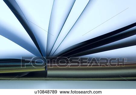 Stock Photo - Notebook with colorful pages lying open on desk. Fotosearch