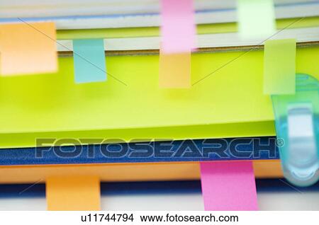 Picture - Notebooks with color coded tabs. Fotosearch
