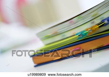 Notebooks with color coded tabs View Large Photo Image Stock Photo - Notebooks with color coded tabs. Fotosearch
