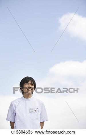Nurse standing outside View Large Photo Image Stock Photography - Nurse standing outside. Fotosearch