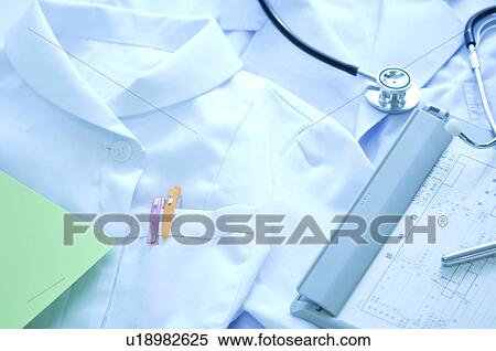 Stock Photography - Nurse uniform, a document and a stethoscope. Fotosearch