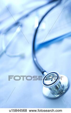 Stock Photo - Nurse uniform, name tag, document and a stethoscope. Fotosearch