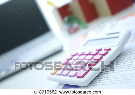 Pink calculator on desk with laptop View Large Photo Image Stock Image - Pink calculator on desk with laptop. Fotosearch