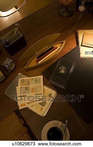 Stock Image - Postage stamps on desk. Fotosearch