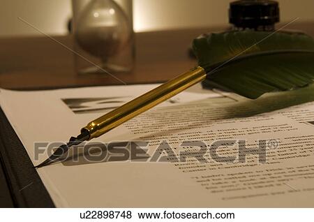 Stock Photo - Quill pen and document on desk. Fotosearch