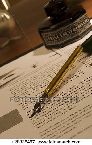 Stock Photo - Quill pen and document on desk. Fotosearch