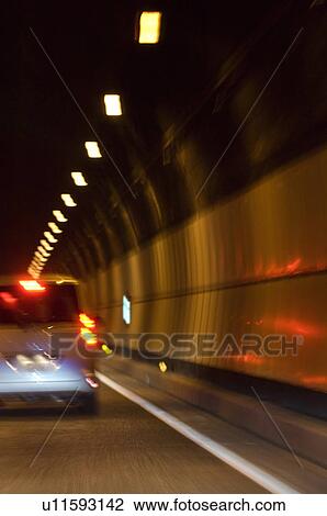 Stock Image - Road traffic in tunnel. Fotosearch