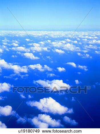 Sea of clouds in blue sky View Large Photo Image Stock Photo - Sea of clouds in blue sky. Fotosearch