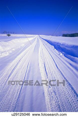 Snow covered road View Large Photo Image Stock Photograph - Snow covered road. Fotosearch