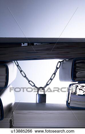 Stack of ringbinders holding up a padlock View Large Photo Image Stock Photograph - Stack of ringbinders holding up a padlock. Fotosearch