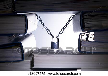 Stack of ringbinders holding up a padlock View Large Photo Image Stock Photography - Stack of ringbinders holding up a padlock. Fotosearch